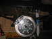 1979 Ford Bronco - Close-up of a vehicle's disc brake assembly, showing the rotor, caliper, and lug nuts.