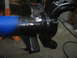 1979 Ford Bronco - A vehicle axle is shown after being painted black, with blue tape marking a section.