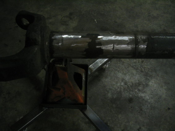 Axle housing on jack stand, showing welds