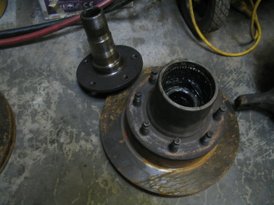 Wheel hub assembly and brake rotor with grease inside the hub