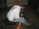 1979 Ford Bronco - A person is using an angle grinder, creating sparks in a garage setting.