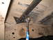 1979 Ford Bronco - Undercarriage view of a vehicle's frame and suspension system.