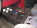 1979 Ford Bronco - Custom center console with gauges and switches. A multi-tool is visible in the storage area.
