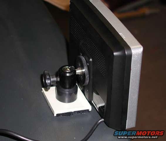 lcd0049.jpg .  It might seem strange but I HATE destroying my dash pad.  I'll cut my dash to pieces but it's just different.  I'm trying a home made mount of 2 velcro strips, a superglued cut down screw, and part of a CDbay Blank.  If it doesn't work I'll get some double sided foam tape.  eventualy I'll get some grey paint that matches my dash or even some vinyl.