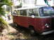 1971 Volkswagen Vanagon - This 1971 Volkswagen Vanagon is seen from a three-quarter front perspective, with its distinctive two-tone red and white paint scheme.