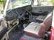 1971 Volkswagen Vanagon - The interior of a 1971 Volkswagen Vanagon reveals its dashboard, steering wheel, and worn seats.