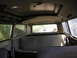 1971 Volkswagen Vanagon - The interior of a 1971 Volkswagen Vanagon shows its age with worn upholstery and a sunroof.