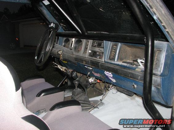 1984 Ford Bronco II interior with roll cage and dashboard