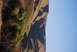 1995 Ford Bronco - A scenic view of rolling hills and vegetation under a clear blue sky, with a website logo visible.