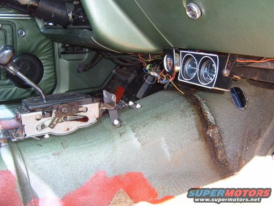 Interior view of a 1973 Ford Ranchero showing the automatic transmission shifter and dashboard gauges