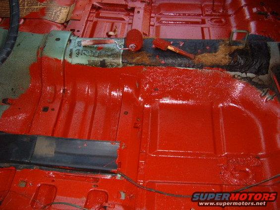 1973 Ford Ranchero interior floor pan painted red with rollers