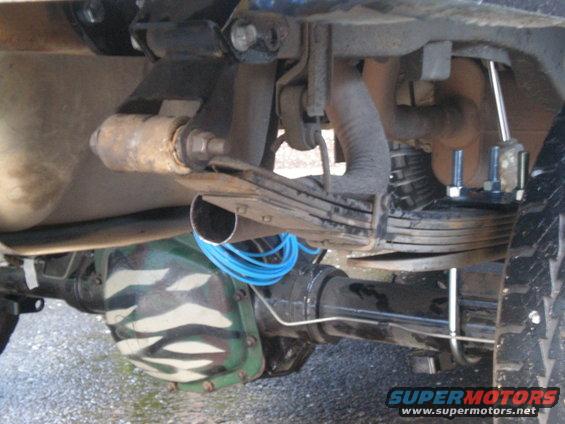 Rear axle with camouflage paint, leaf springs, and exhaust pipe