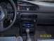 1989 Mazda MX-6 - The interior of a 1989 Mazda MX-6, a dashboard with gauges, air vents, and a center console with a gear shifter and stereo.