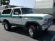 1978 Ford Bronco - This two-tone Ford Bronco is shown from the front three-quarter view, parked outdoors.