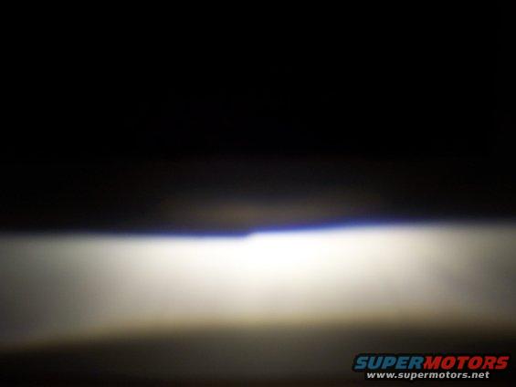 Headlight beam with blue tint at top