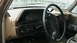 1990 Ford Bronco - Interior view of a 1987 Ford F-150 dashboard with a prominent steering wheel and instrument cluster.