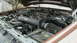 1990 Ford Bronco - The engine bay of a brown 1990 Ford Bronco, showing an aftermarket K&N air intake system.