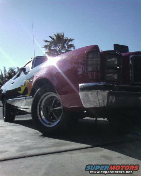 Rear quarter view of a 1978 Ford Ranchero with flame decals on the side