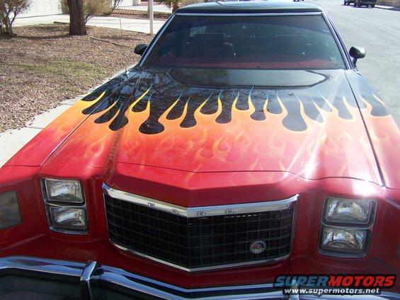 1978 Ford Ranchero front view with red paint and flame graphics on hood