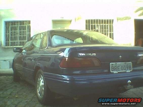 Dark blue 1995 Ford Taurus sedan, rear view, with license plate BRE 0098