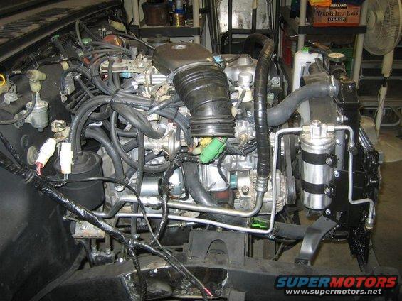 Engine bay with hoses and wiring