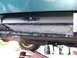 1995 Mercury Grand Marquis - Close-up view of rust repair work on the rocker panel of a vehicle.
