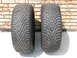 2003 Ford Crown Victoria - A pair of tires are shown against a brick wall. The tread pattern is a V-shape.