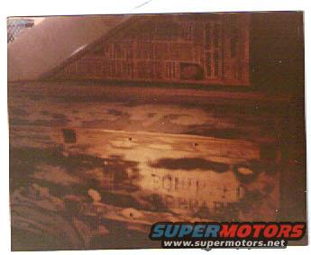Rear bumper with text, Supermotors logo visible