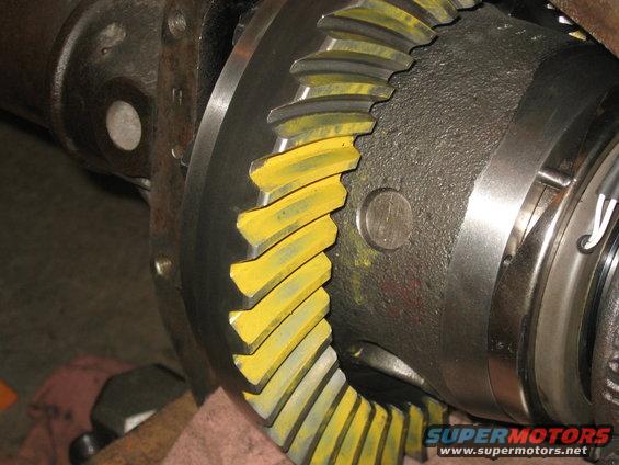 Close-up of differential gears with yellow markings
