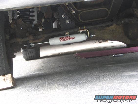 Undercarriage view of steering stabilizer with 'Rough Country' text