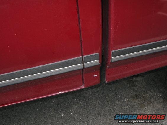 1991 Ford F-150 red door and bed seam with chrome trim