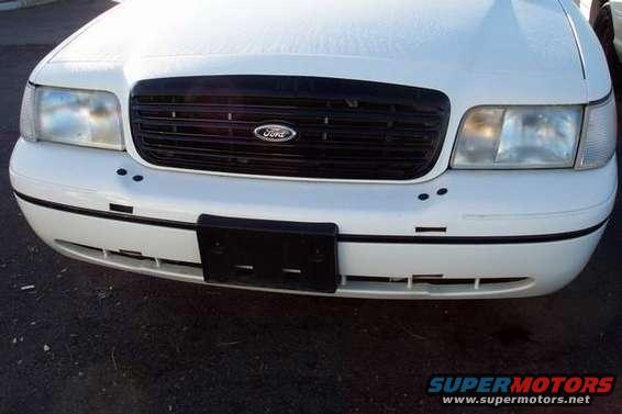 White 1998 Ford Crown Victoria front end with black grille and Ford badge