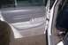 1996 Ford Crown Victoria - Interior view of a car door panel, including the handle and armrest.