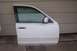 1996 Ford Crown Victoria - A detached white car door is shown, with handwritten numbers on the window.