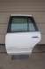 1996 Ford Crown Victoria - Rear passenger door from a 1996 Ford Crown Victoria, a chrome door handle and tinted window.