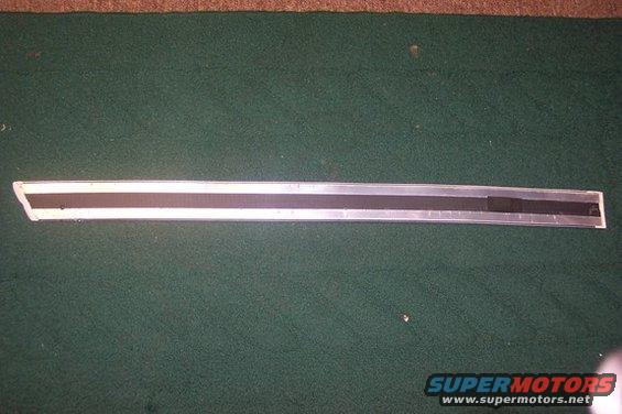 Silver and black door trim piece