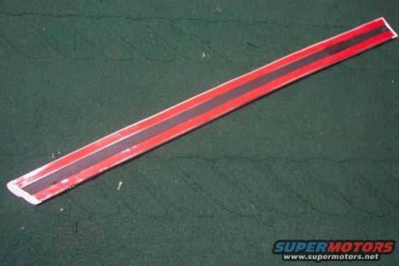 Red and black trim piece with textured black stripe