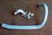 1996 Ford Crown Victoria - Oil cooler and a blue hose are shown on a brown, carpeted surface.