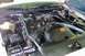 1996 Ford Crown Victoria - Engine bay view showing components like batteries and hoses, with a caution label on the fan shroud.