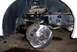 1996 Ford Crown Victoria - Close-up view of a vehicle's front wheel brake assembly, showing a new rotor and caliper.