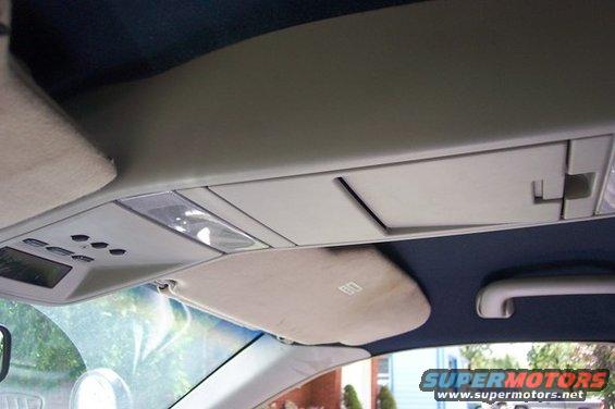 Car's overhead console with lights and storage compartments, plus a sun visor