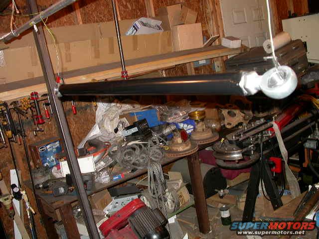 dscn6382.jpg Trac bar fabbed and painted.  It's 36 3/8" center to center if I recall.
