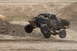 2008 Ford Bronco - This off-road buggy is captured mid-air during a race, with the number 107 clearly visible on its side.