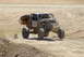 2008 Ford Bronco - A custom off-road buggy, marked with number 107, takes flight over a dusty track.
