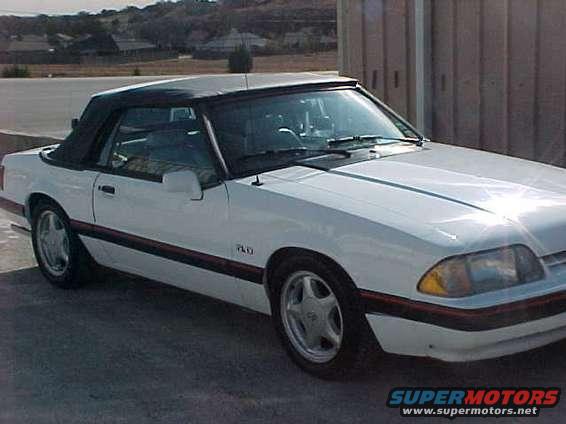 White 1989 Ford Mustang convertible parked outdoors