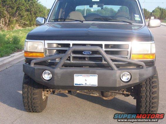 1992 Ford Bronco front end with aftermarket bumper and brush guard, Texas license plate visible
