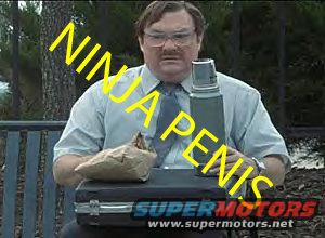 Man in shirt and tie sits outside with a sandwich, thermos, and briefcase. Yellow text says NINJA PENIS. Super Motors logo is visible