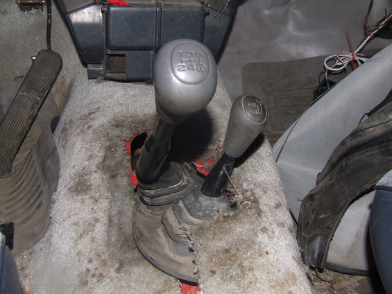 Interior view of two gear shifters, one labeled 4WD