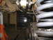 1979 Ford Bronco - Vehicle suspension components are visible, including springs and a sway bar link.