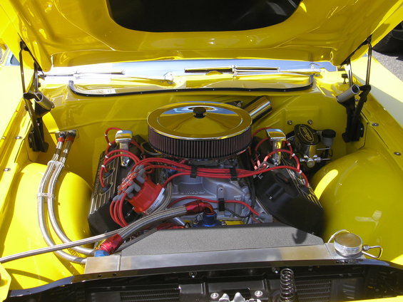 yellow engine bay with chrome air cleaner and red spark plug wires